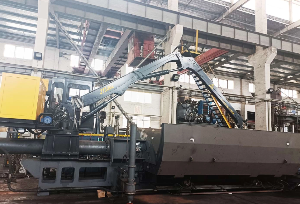 alt:Fuman truck crane handling steel components inside a mill, ensuring safe and efficient heavy load operations.
