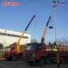 Telescopic-Boom Vehicle-Mounted Cranes with Adjustable Reach Capability